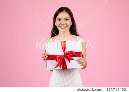 Lady presenting a gift with red ribbon 113718460