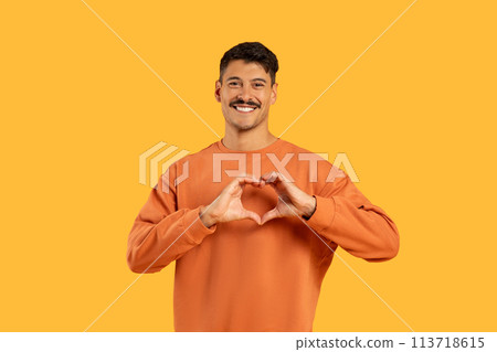Man with moustache making heart shape with hands Man with moustache making heart shape with hands 113718615