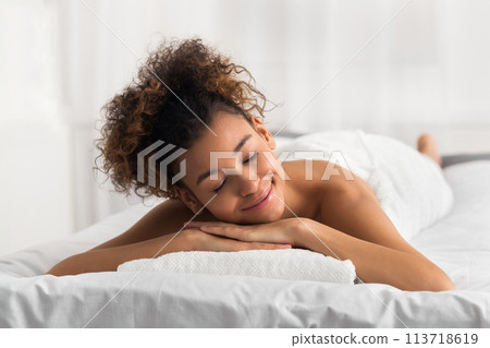 African-american woman in spa salon, waiting for massage African-american woman in spa salon, waiting for massage 113718619