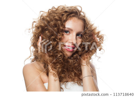 Adorable young woman with natural make-up, clear fresh skin and wavy hairstyle on white background 113718640