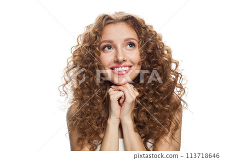 Laughting young woman with natural make-up, clear fresh skin and wavy hairstyle on white background Laughting young woman with natural make-up, clear fresh skin and wavy hairstyle on white background 113718646