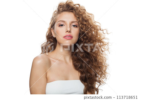 Glamorous young woman with natural make-up, clear fresh skin and wavy hairstyle on white background 113718651