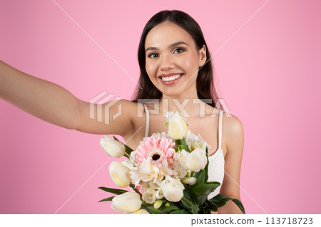 Lady taking a selfie with pink flowers Lady taking a selfie with pink flowers 113718723
