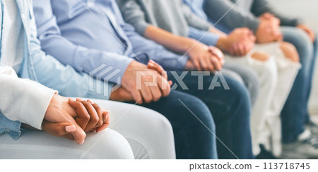 Diverse Unrecognizable People Holding Hands, Sitting In A Row Indoors 113718745