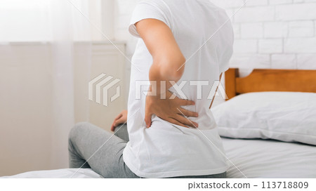 African-american woman having back pain after sleep 113718809