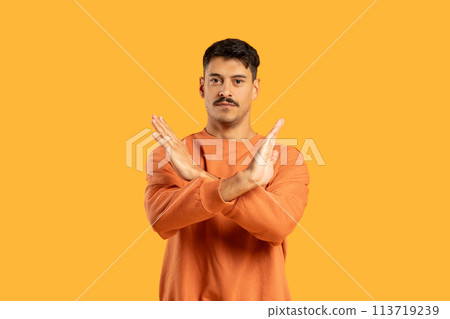 Man gesturing no sign with crossed arms 113719239