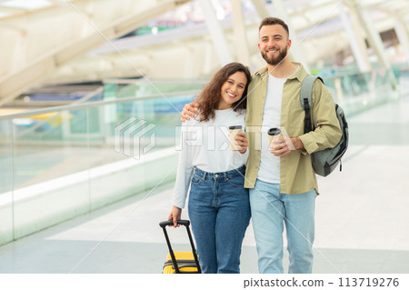Happy couple at the airport with luggage 113719276