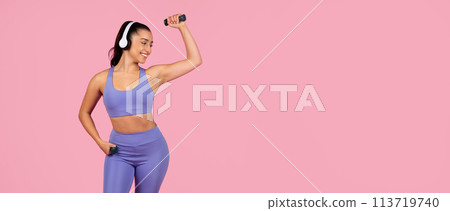 Sporty woman listening to music and dancing Sporty woman listening to music and dancing 113719740