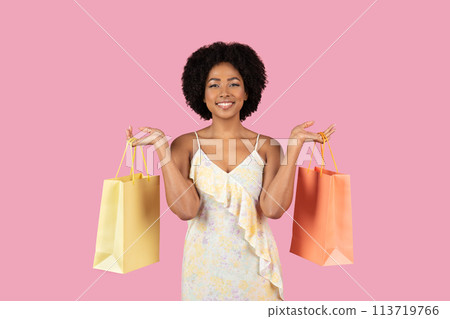 Happy African American woman with shopping bags Happy African American woman with shopping bags 113719766