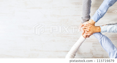 United millennials standing with their hands together, top view United millennials standing with their hands together, top view 113719879