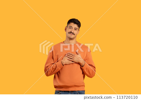 Man with mustache smiling on yellow background Man with mustache smiling on yellow background 113720110