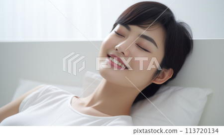 A young lady sleeping on bed 113720134