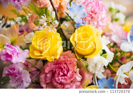 Colorful flower arrangement on the table 113720378