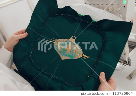 Embroidery machine needle in Textile Industry at Garment Manufacturers, Embroidery T-shirt in progress, Needle with thread Embroidery machine needle in Textile Industry at Garment Manufacturers, Embroidery T-shirt in progress, Needle with thread 113720904