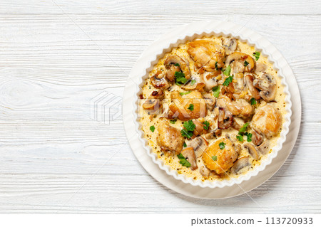 chicken thighs in a creamy mushroom garlic sauce 113720933
