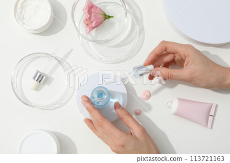 Cosmetics with chemical flasks and a flower Cosmetics with chemical flasks and a flower 113721163