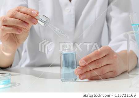 Cosmetics with chemical test tubes and pipette Cosmetics with chemical test tubes and pipette 113721169