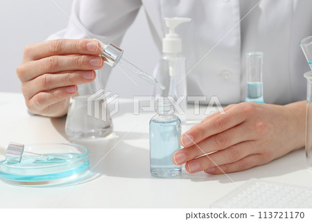 Cosmetics with chemical test tubes and pipette Cosmetics with chemical test tubes and pipette 113721170