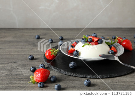 Dessert panna cotta, on the table, on a gray background. Dessert panna cotta, on the table, on a gray background. 113721195