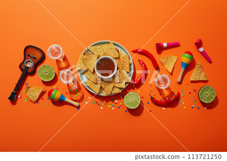 Nachos with tequila lime and festive decorations Nachos with tequila lime and festive decorations 113721250