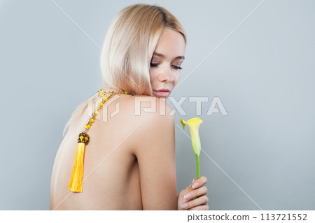 Fashion portrait of blonde person portrait. Beauty woman with clear shiny fresh skin and blond hair 113721552