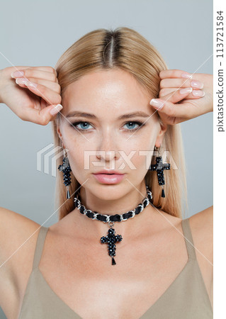 Close up face of fashion jewelry model woman. Lady with fresh clean skin, blonde hair 113721584