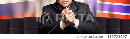 Politician or businessman on oil barrels background and background of Norway and Russia flags 113721697