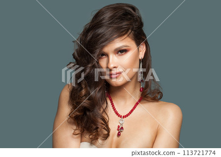 Nice healthy model woman with beautiful hairstyle, fresh skin and make-up wearing jewelry.  113721774