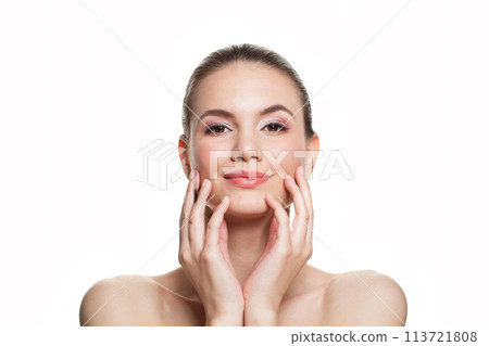 Wellness young woman with fresh silky skin posing on white background.  113721808