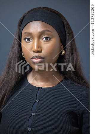 Portrait of a Confident Young Woman with Classic Style 113722209