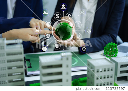 Businessman team brainstorming using tablet, laptop computer for working technology and business,  Renewable energy-based green businesses and global warming. Reduce CO2 emission. 113722597
