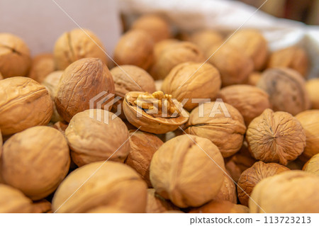 walnuts in a bag are sold at the market walnuts in a bag are sold at the market 113723213