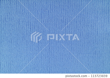Blue knitted woolen jersey fabric, sweater, pullover texture, abstract background Blue knitted woolen jersey fabric, sweater, pullover texture, abstract background 113723839