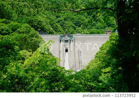 The embankment of Okususobana Dam releasing water 113723952