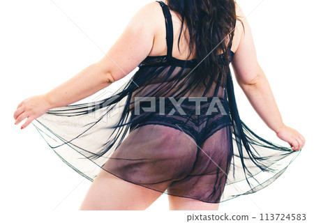 Plus size woman in lingerie tunic 113724583