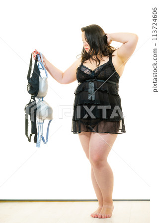 Plus size woman fitting bras 113724606