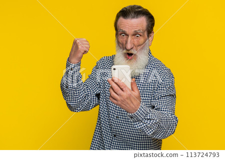 Happy excited winner old man use smartphone celebrating success, winning play game good lottery news Happy excited winner old man use smartphone celebrating success, winning play game good lottery news 113724793