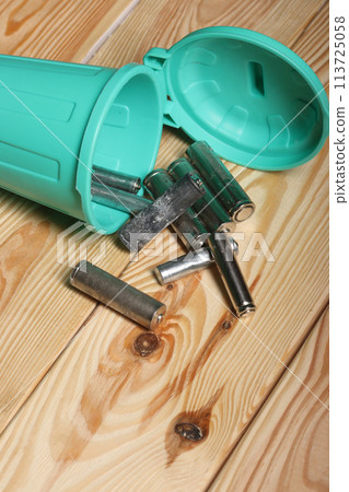Used finger batteries in a miniature trash can.  pine boards. 113725058