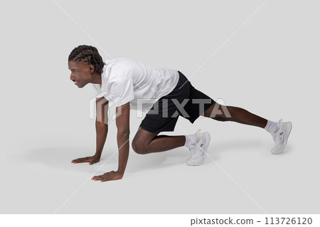 Man in starting position ready to sprint 113726120