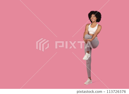 Woman performing a stretching exercise 113726376