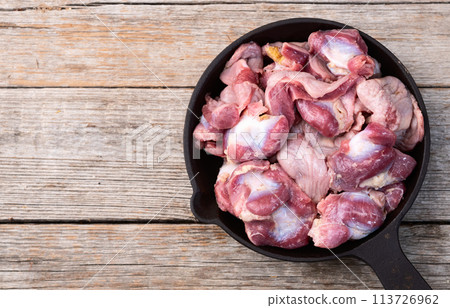 Raw chicken giblets gizzard ( stomach ) , meat background 113726962