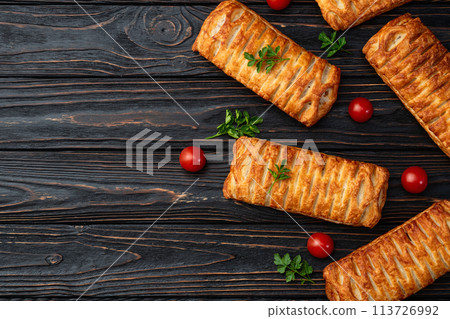 Golden Puff pastry stuffed with sausage and cheese 113726992