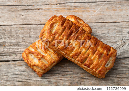 Golden Puff pastry stuffed with sausage and cheese Golden Puff pastry stuffed with sausage and cheese 113726999