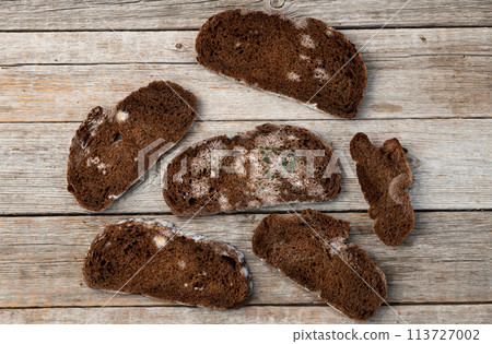 Piece of dark Molded bread 113727002