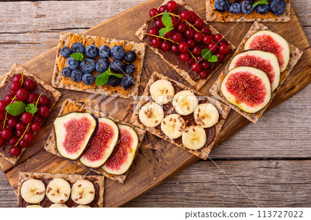 Rice cake with banana  blueberry redcurrant and figs 113727022