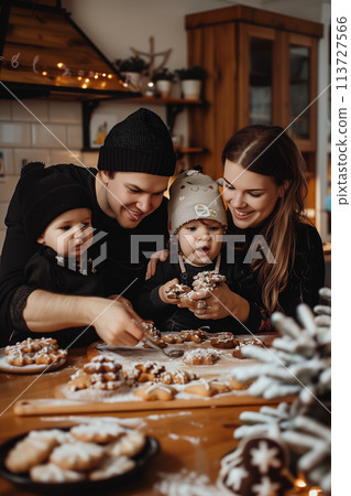 Happy family baking and decorating tasty cookies in cozy home kitchen 113727566
