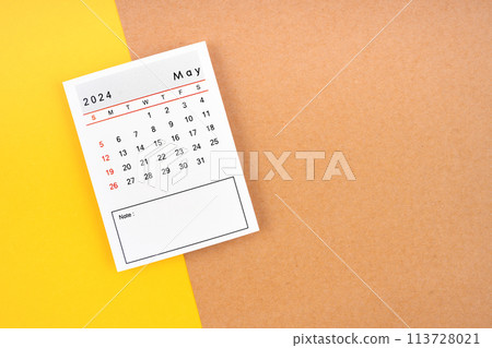 Calendar page for May 2024 on a yellow and brown. 113728021
