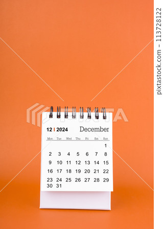Vertical of December 2024 table calendar on orange background. Vertical of December 2024 table calendar on orange background. 113728122