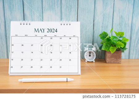May Monthly desk calendar for 2024 year and alarm clock. 113728175
