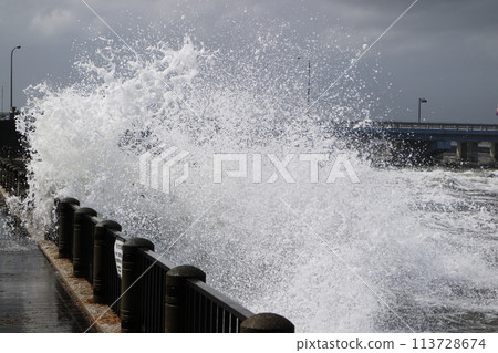 Waves beyond breakwater 113728674